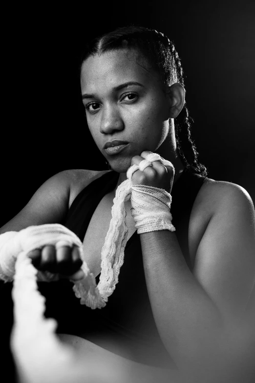 a black and white photo of a female boxer, inspired by Carrie Mae Weems, flickr, north adult female warrior, getty images, black young woman, sydney park