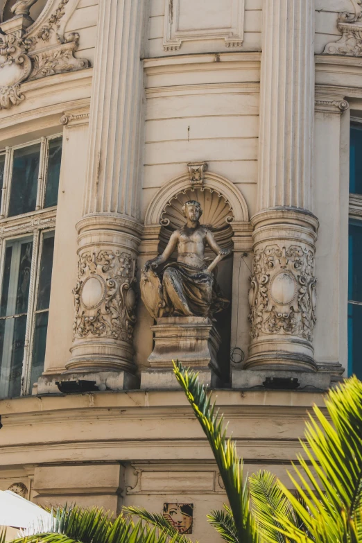 a building with a statue on top of it, buenos aires, regal pose, intricate upper body, on ocean