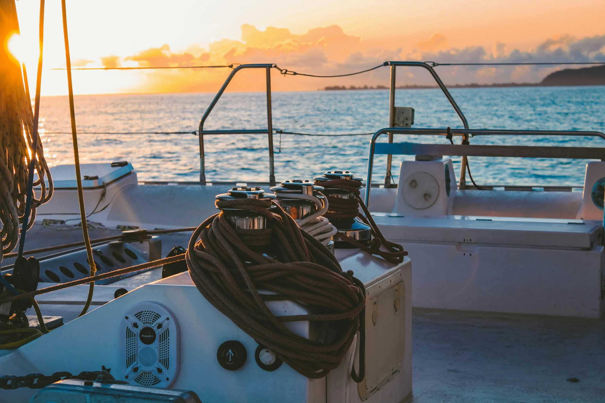 a boat sitting on top of a body of water, happening, at sunset, moored, helmet view, nautical maps