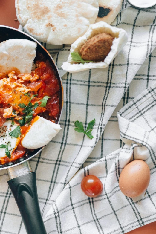 a pan filled with food sitting on top of a table, a still life, trending on unsplash, eggs, tehran, banner, thumbnail