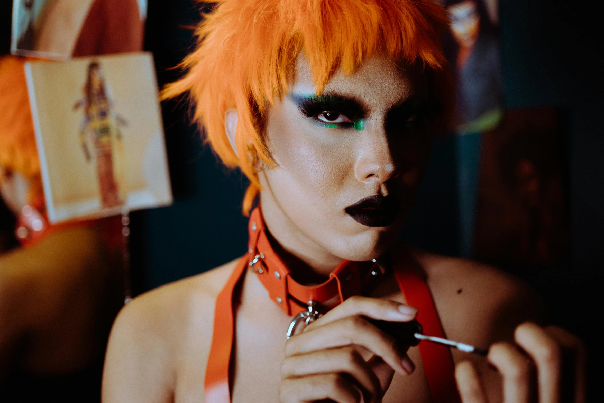 a woman with orange hair smoking a cigarette, an album cover, trending on pexels, rave makeup, androgyny, wearing a punk outfit, behind the scenes photo