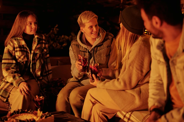 a group of people sitting around a fire, nightcap, cosy vibes, brown