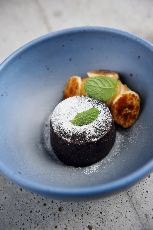 a close up of a plate of food on a table, a still life, fully chocolate, charred desert, jasmine, blue