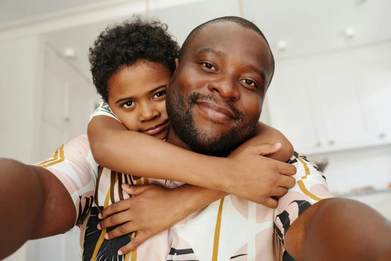 a man taking a selfie with a little girl, by Carey Morris, pexels, ( brown skin ), two men hugging, avatar image, maintenance