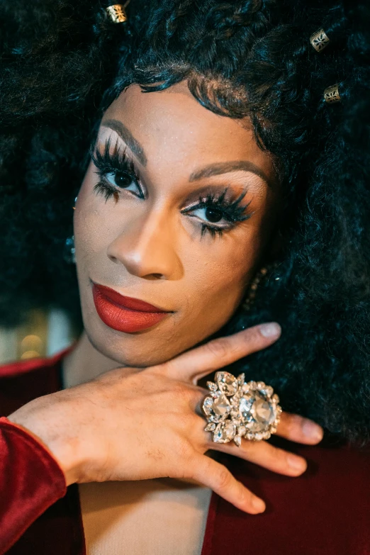 a close up of a person with a ring on their finger, an album cover, by Winona Nelson, renaissance, ru paul\'s drag race, looking straight to camera, riyahd cassiem, trending arstationhq