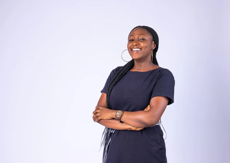 a woman standing with her arms crossed and a smile on her face, by Chinwe Chukwuogo-Roy, pexels contest winner, hurufiyya, on clear background, vp of marketing, facebook post, multiple stories