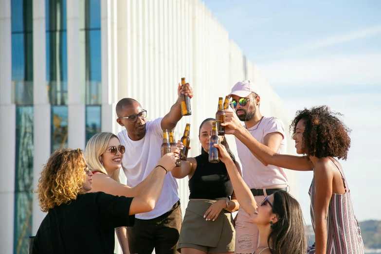 a group of people holding up beer bottles, city rooftop, profile image, essence, extra high resolution