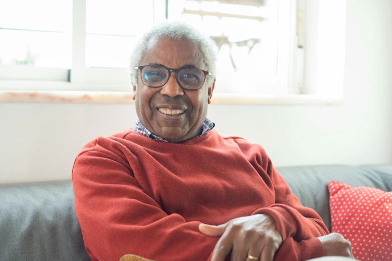 a close up of a person sitting on a couch, les nabis, grandfatherly, mkbhd, portrait image, barry smith