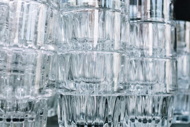 a bunch of glasses stacked on top of each other, inspired by Cornelia Parker, unsplash, crystal cubism, ready to eat, filling with water, medium close shot, extremely polished