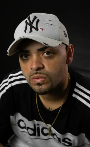 a close up of a person wearing a baseball cap, inspired by Christopher Williams, les nabis, portrait pose, album photo, looking towards camera, joe alves