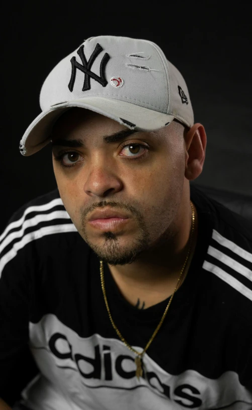 a close up of a person wearing a baseball cap, inspired by Christopher Williams, les nabis, portrait pose, album photo, looking towards camera, joe alves