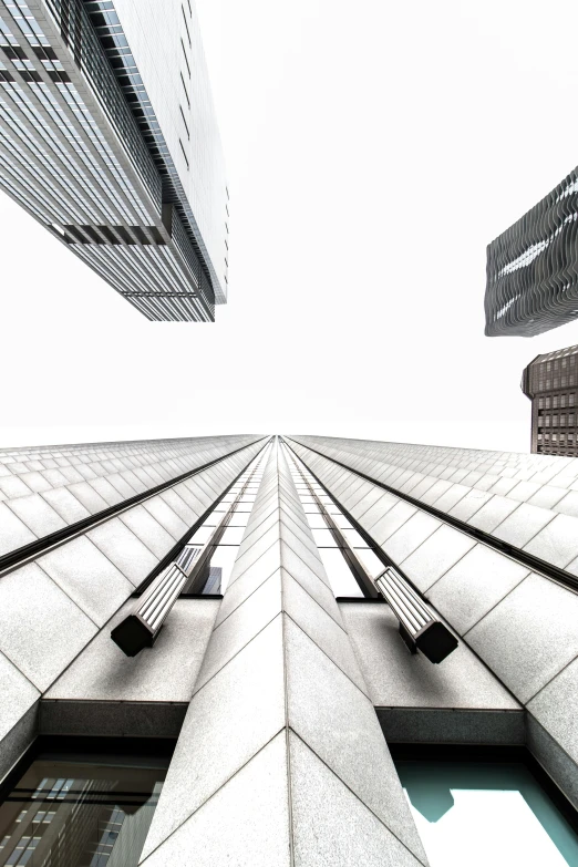 a very tall building with a lot of windows, by Jacob Toorenvliet, pexels contest winner, postminimalism, skyscrapers and flying cars, square lines, mies van der rohe, shot from roofline