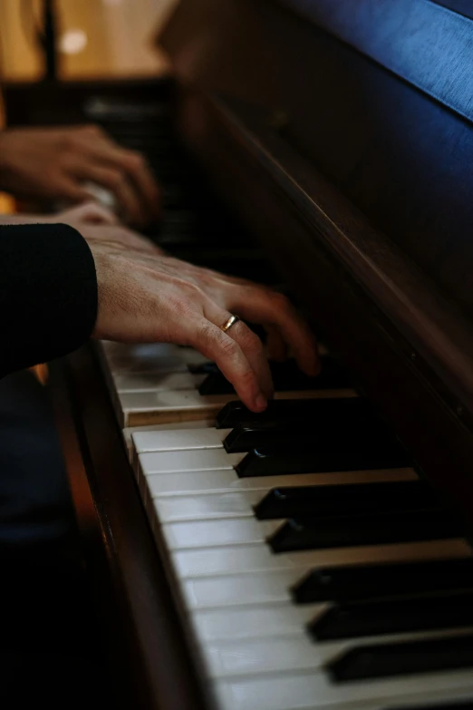 a close up of a person playing a piano, by David Simpson, paul barson, diana levin, gentleman, slightly golden