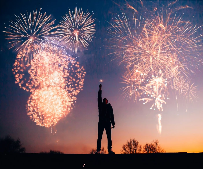 a person standing on a hill with fireworks in the sky, profile image, trending photo, thumbnail, 🚿🗝📝