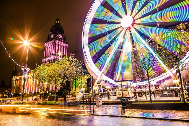 a ferris wheel in the middle of a city at night, interactive art, glasgow in background, square, holiday season, thumbnail