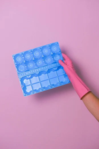 a person in pink gloves holding a blue box, by Julia Pishtar, plasticien, perfectly tileable, translucent eggs, female calendar, bottom - view