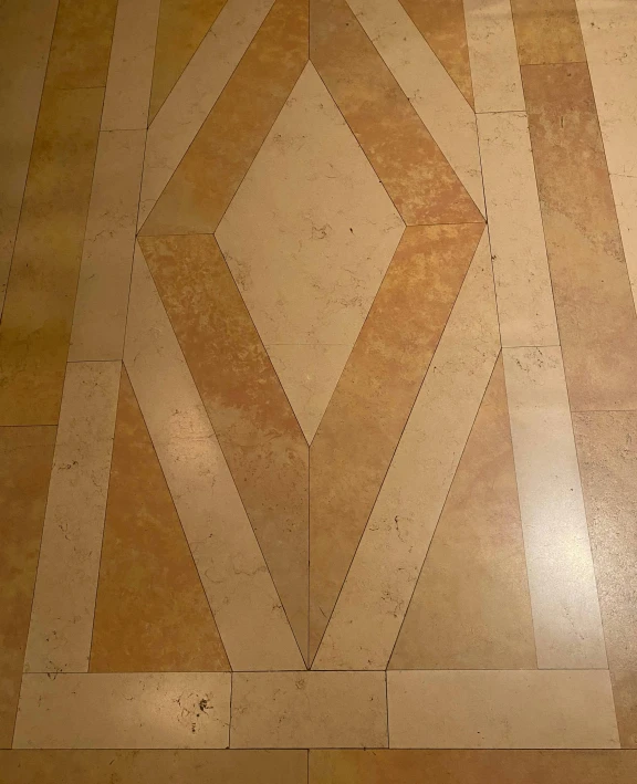 a white toilet sitting on top of a tiled floor, an album cover, by Theo Constanté, reddit, renaissance, oak parquet, inlaid with gold, high angle close up shot, triangles