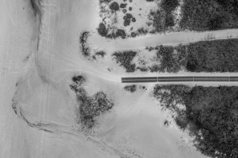 a black and white photo of a road, inspired by Jan Rustem, conceptual art, satelite imagery, near the beach, uploaded, truck