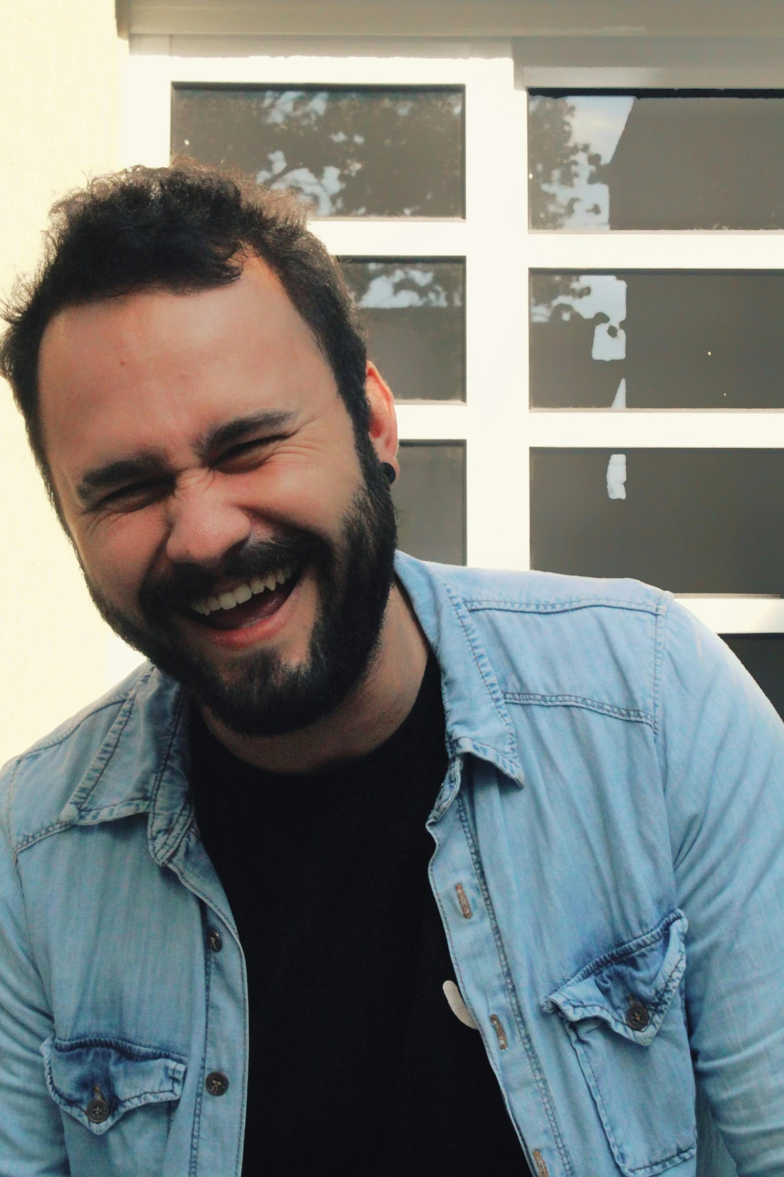 a man with a beard sitting in front of a cake, an album cover, inspired by Germán Londoño, trending on reddit, hurufiyya, smiles slightly, full frame image, telegram sticker, charlie day