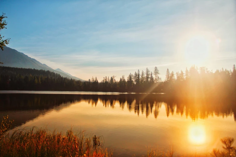 the sun is setting over a mountain lake, by Jessie Algie, pexels contest winner, autumn sunlights, whistler, clear sunny day, stunning screensaver