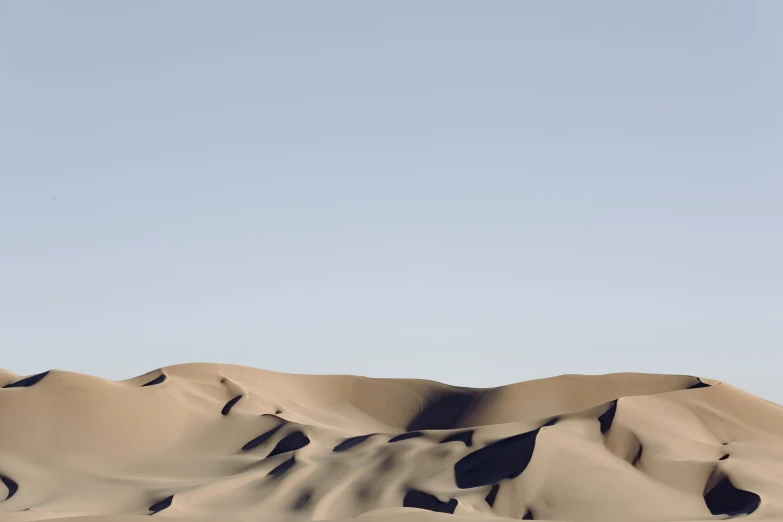 a group of people riding horses across a desert, by Eglon van der Neer, unsplash contest winner, computer art, minimalist photorealist, victorian arcs of sand, low angle photograph, beautiful composition 3 - d 4 k