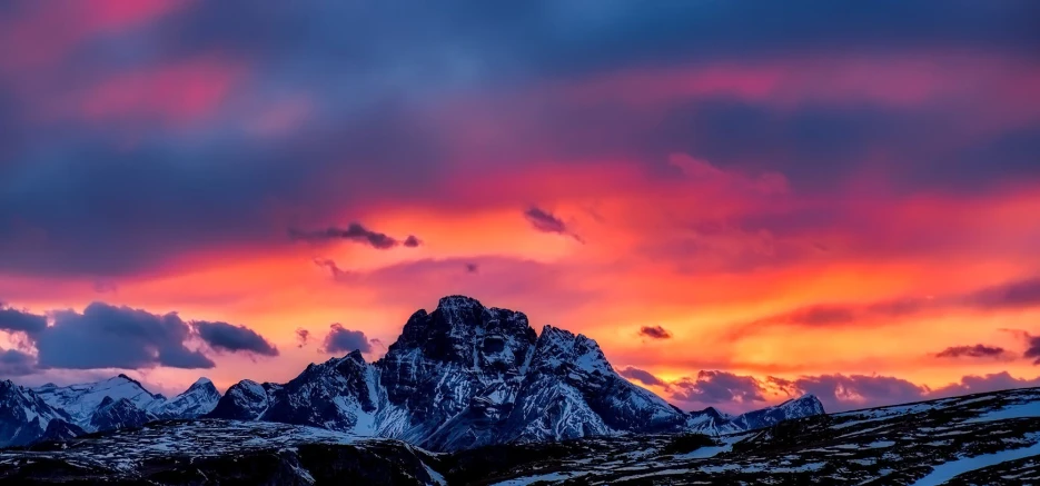 a mountain range with a colorful sky in the background, pexels contest winner, romanticism, italy, fire and ice, dramatic ”