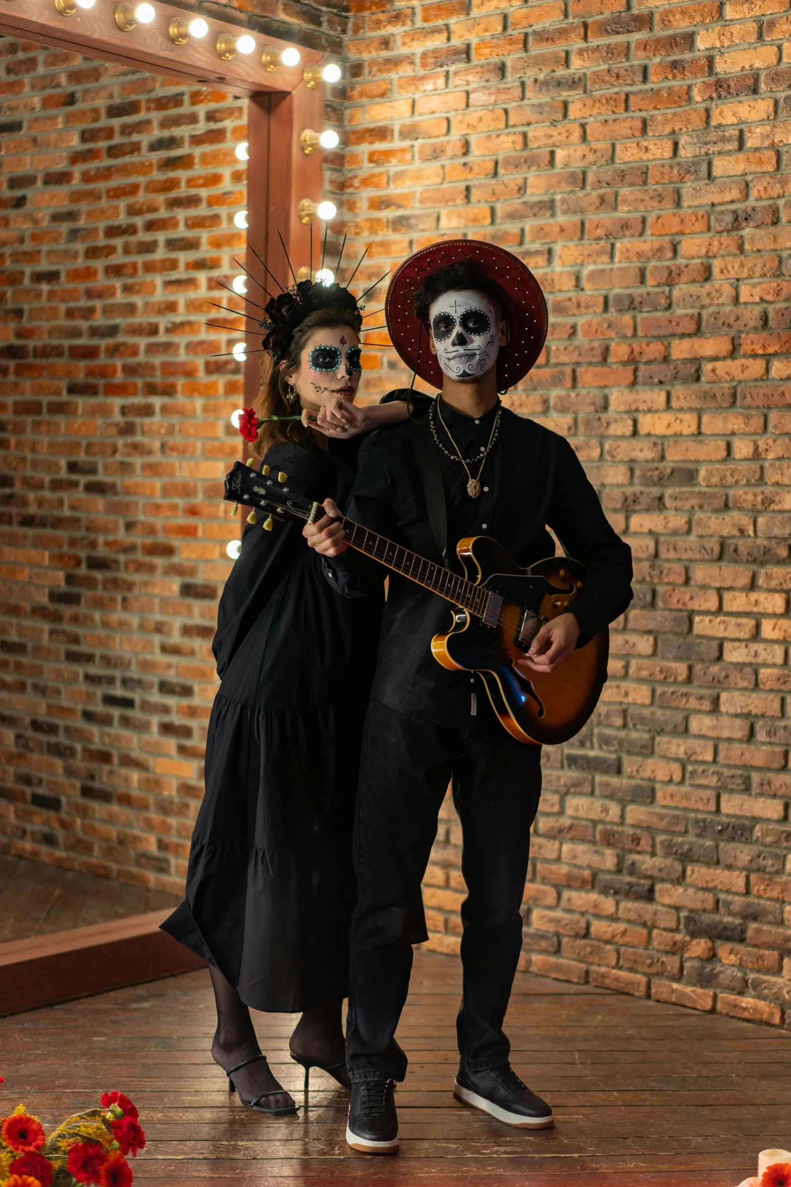 a man and a woman in day of the dead costumes, an album cover, pexels contest winner, vantablack wall, guitarists, low quality photo, vine