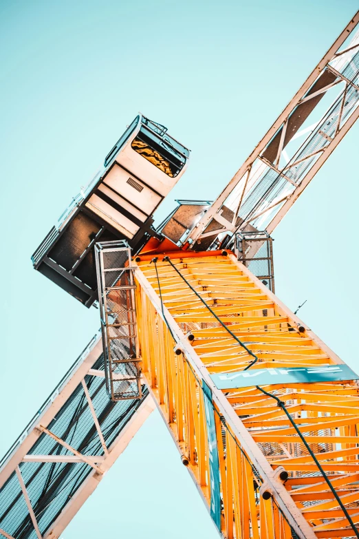 a crane that is sitting on top of a building, pexels contest winner, constructivism, cyan and orange, ( ferris wheel ), ladder, extra high resolution