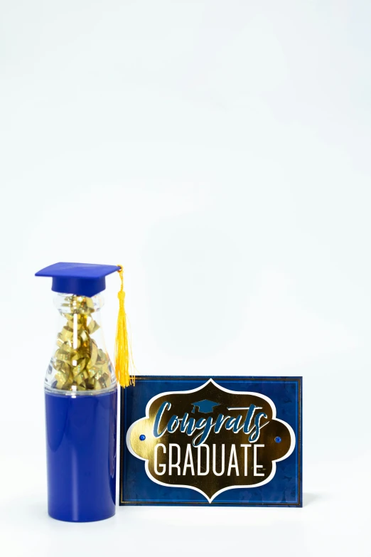 a blue bottle filled with gold confetti and a graduation cap, a picture, # 6 6 9 3 fs, large props, extra details, sleek