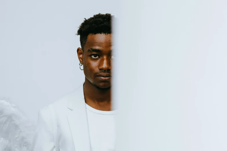 a man in a white shirt and angel wings, a character portrait, pexels contest winner, playboi carti portrait, mkbhd as iron man, handsome young man, mid length portrait photograph
