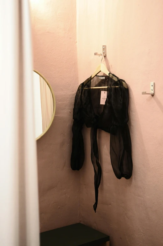 a bathroom with a black jacket hanging on the wall, unsplash, renaissance, translucent dress, 🎀 🧟 🍓 🧚, bralette, no detail