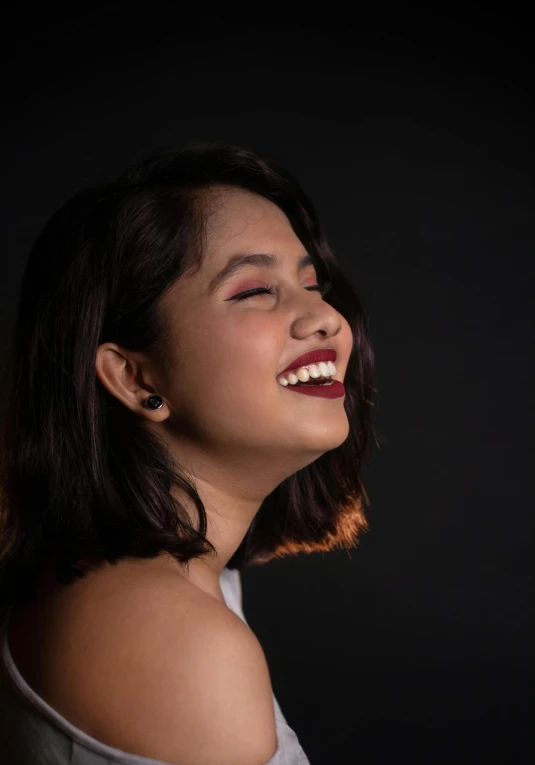 a woman with a smile on her face, an album cover, inspired by reyna rochin, pexels contest winner, realism, studio!! portrait lighting, candid photo, smileing nright, candid picture