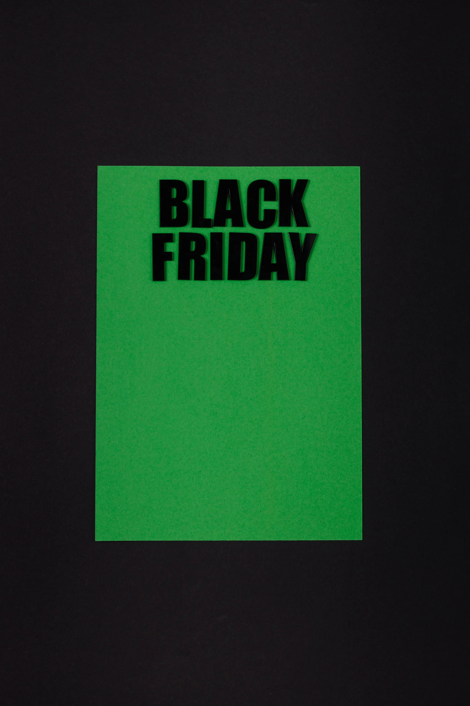 a green piece of paper with black friday written on it, an album cover, inspired by John Brack, flickr, black t-shirt, vantablack cloth technology, bright:, ffffound