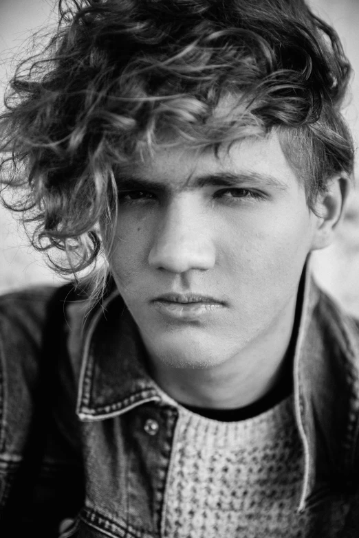 a black and white photo of a young man, tumblr, curly dirty blonde hair, in thomas ruff style, getty images, male character