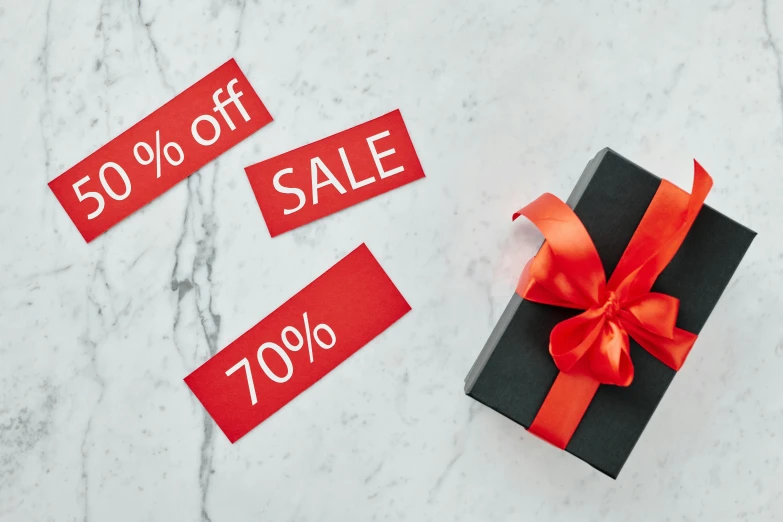 a black gift box with a red ribbon and 50 % off sale tags, pexels contest winner, visual art, all marble, 2 0 7 7, monochrome, 2077