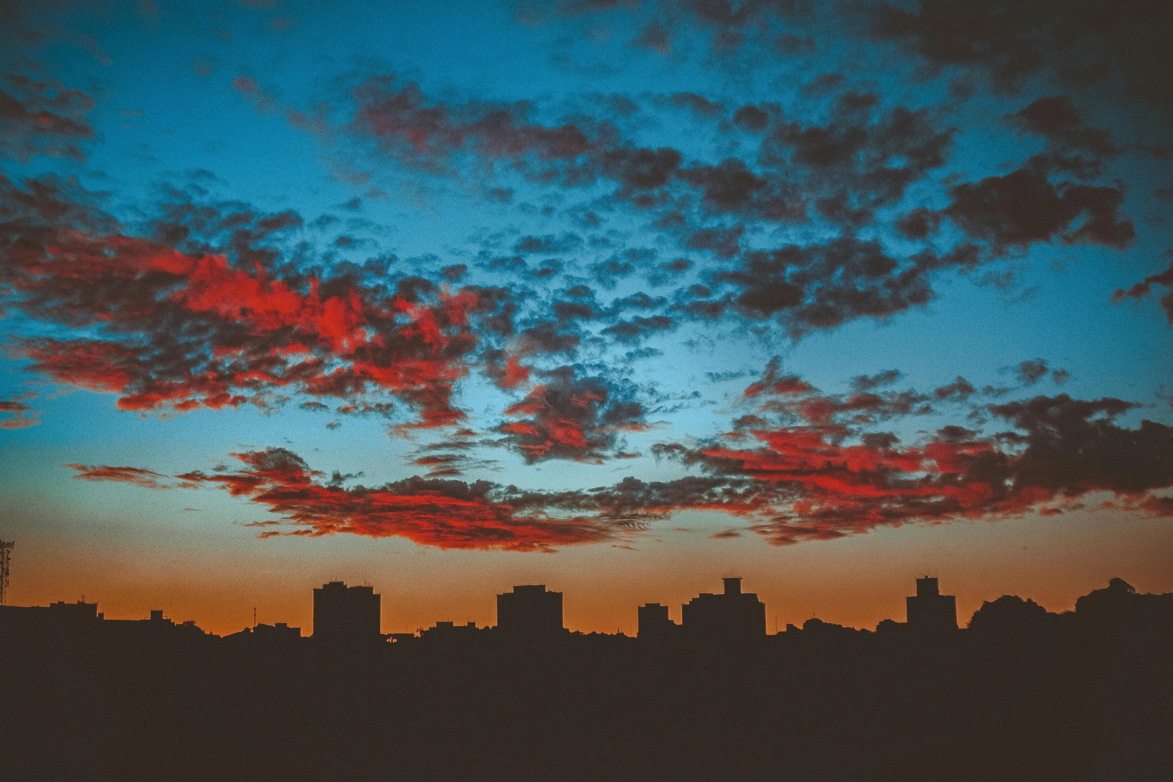 a red and blue sky over a city, pexels contest winner, minimalism, dark, major arcana sky, late afternoon, sprawling