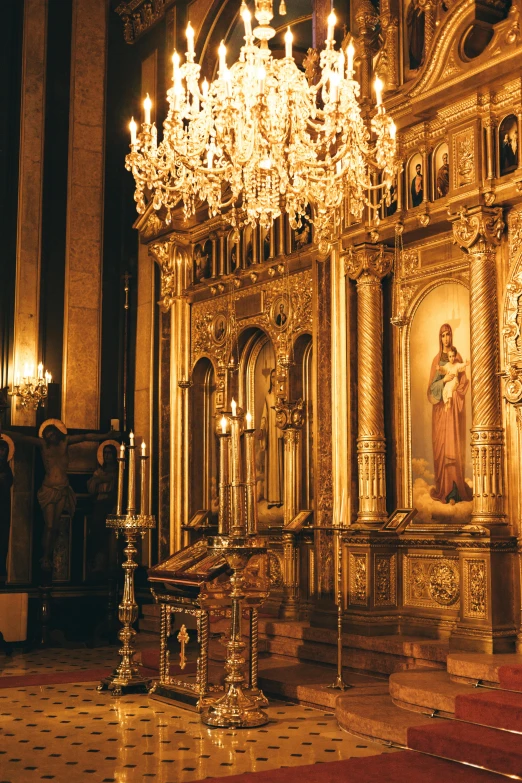a church with a chandelier in the middle of it, inspired by Nikolay Nikanorovich Dubovskoy, baroque, in front of a carved screen, standing in gold foil, split near the left, catholic icon