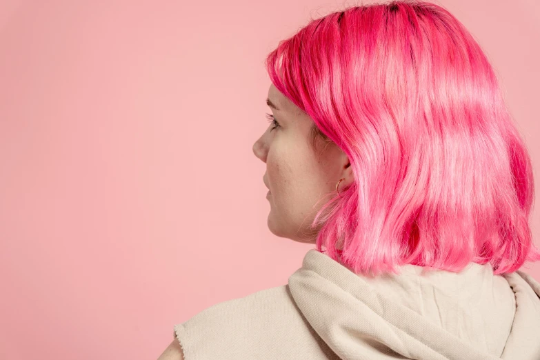 a close up of a person with pink hair, inspired by Elsa Bleda, trending on pexels, synchromism, side profile waist up portrait, coloured background, teenager girl, over the shoulder view