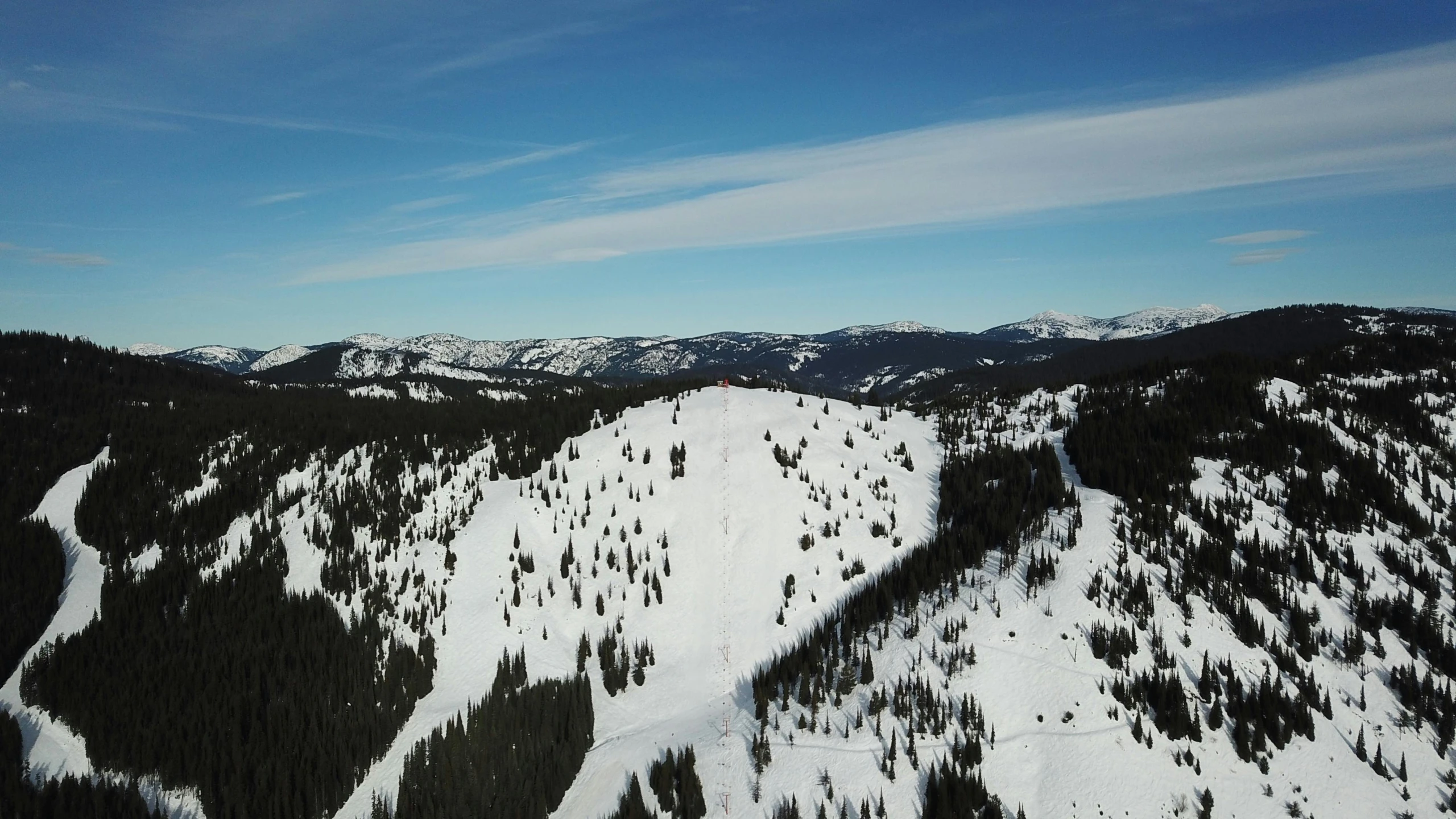 a man riding a snowboard down the side of a snow covered slope, from 1 0 0 0 feet in distance, black fir, profile image, maintenance photo