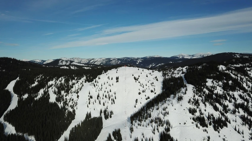 a man riding a snowboard down the side of a snow covered slope, from 1 0 0 0 feet in distance, black fir, profile image, maintenance photo