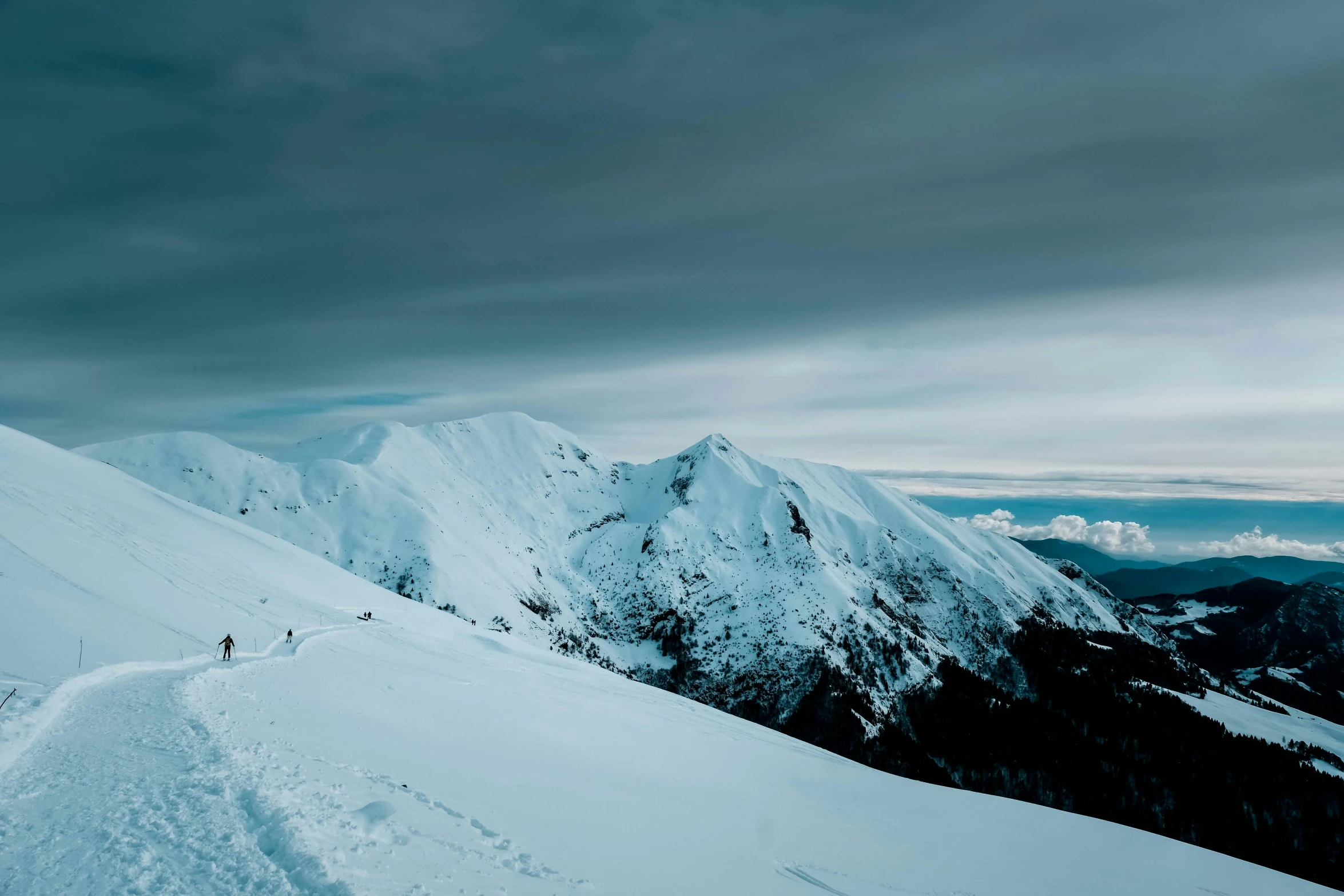 a person standing on top of a snow covered mountain, pexels contest winner, baroque, thumbnail, cold hues, new zealand, slide show