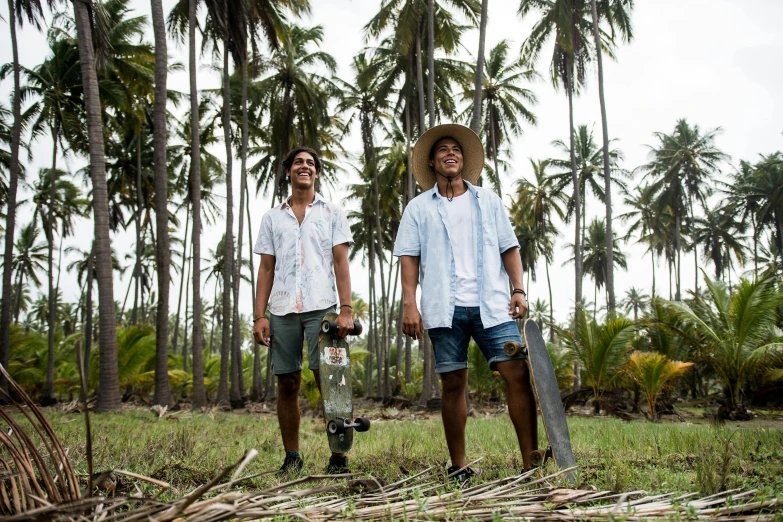 a couple of men standing on top of a lush green field, coconuts, pablo perdomo, surf, profile image