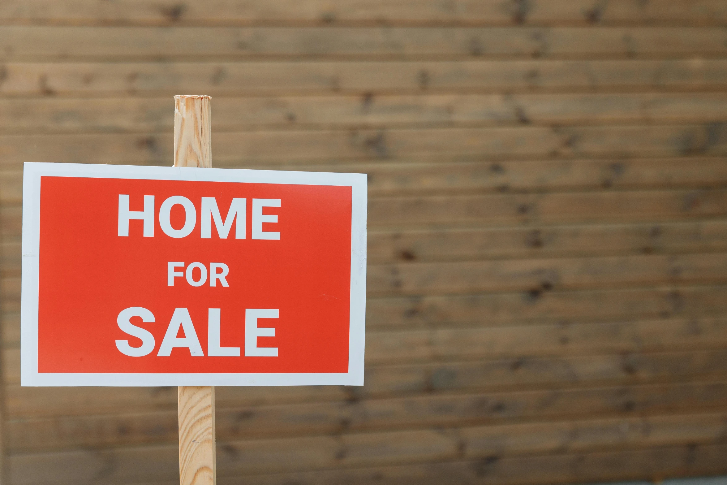 a home for sale sign in front of a wooden wall, unsplash, square, brown, plain background, white