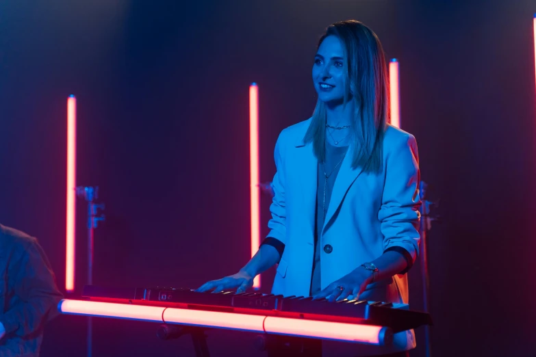 a woman that is standing in front of a keyboard, blue and red lights, band playing, avatar image, commercial