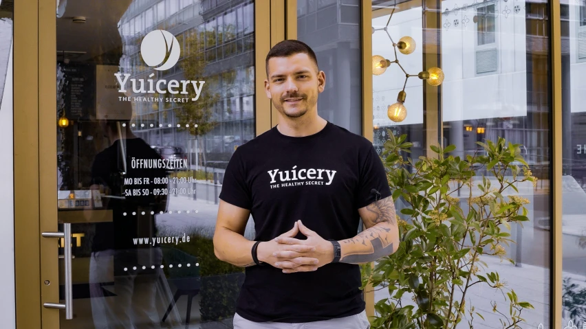 a man that is standing in front of a building, inspired by Jan Kupecký, instagram, hurufiyya, fresh bakeries in the background, vp of marketing, vascularity, gurney