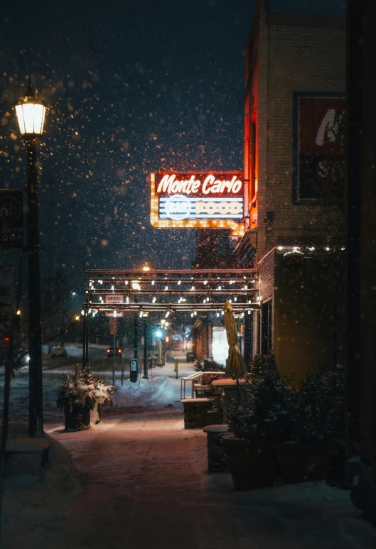 a city street at night covered in snow, poster art, by Matt Cavotta, pexels contest winner, theater, storefront, exterior photo, cinestill eastmancolor