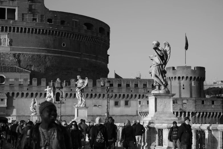 a black and white photo of a crowd of people, a black and white photo, by Patrick Pietropoli, pexels contest winner, renaissance, statue, colosseo, red castle in background, winter sun