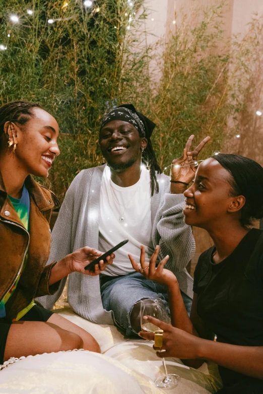 a group of women sitting next to each other, trending on pexels, afrofuturism, a still of a happy, very kenyan, having a great time, instagram photo