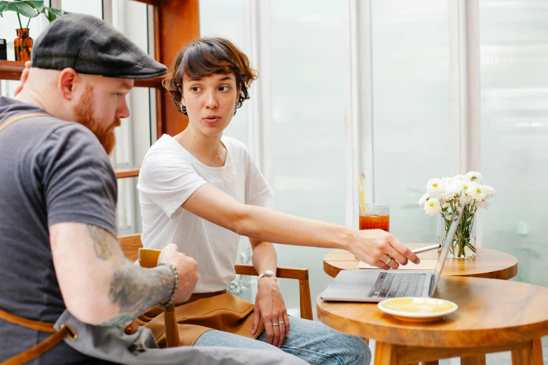 a man and a woman sitting at a table with a laptop, by Nicolette Macnamara, pexels contest winner, aussie baristas, james jean and yoji shinkawa, avatar image, casey cooke