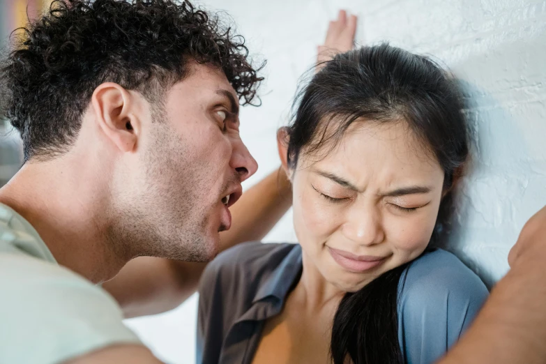 a man and a woman standing next to each other, trending on pexels, renaissance, screaming in pain, an asian woman, in australia, fighting each other